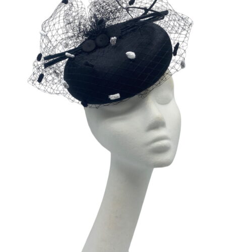 Stunning simple litlle black pillbox with gorgeous monochrome pompom veiling overlay.